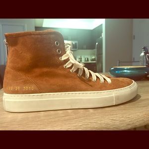 Gently used common project suede high tops.